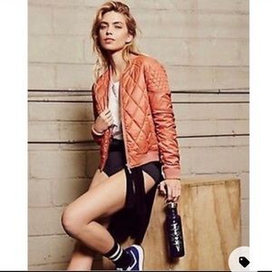 Orange quilted bomber jacket